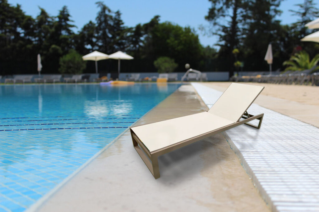 Marbella Classic aluminium sun lounger for hotels beside a pool with clean minimal sling surface
